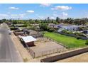 Aerial view of a residential property highlighting its fenced areas and the surrounding neighborhood at 4502 W Greenway Rd, Glendale, AZ 85306