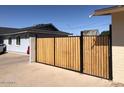 Home backyard featuring a new wood and metal gate at 4517 S Grandview Ave, Tempe, AZ 85282