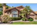 Attractive single-story home featuring a tidy lawn and diverse landscaping, creating an inviting curb appeal at 5018 E Kathleen Rd, Scottsdale, AZ 85254