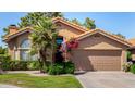 Beautiful single-story home with lush landscaping and a well-maintained front yard on a sunny day at 5018 E Kathleen Rd, Scottsdale, AZ 85254