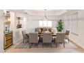 Elegant dining room with a wooden table and comfortable seating, perfect for Gathering gatherings at 6739 E Thunderbird Rd, Scottsdale, AZ 85254