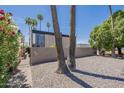 Unique mid-century modern home with concrete wall and desert landscaping at 1123 E Maryland Ave # 4, Phoenix, AZ 85014