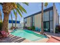 Backyard view showcasing pool, patio furniture, and home exterior at 1123 E Maryland Ave # 4, Phoenix, AZ 85014
