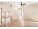 Inviting living room with tile floors, ceiling fan, and views to other rooms at 1202 W Wickieup Ln, Phoenix, AZ 85027