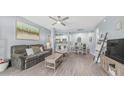 Cozy living room with modern decor, stylish furniture, ceiling fan, and open layout at 14145 N 92Nd St # 1084, Scottsdale, AZ 85260