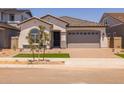 Charming single-story home featuring a two-car garage, neutral paint and tile roof at 15642 W Georgia Dr, Surprise, AZ 85379