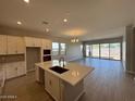 Open-concept kitchen featuring an island with a sink, and stainless steel appliances at 15642 W Georgia Dr, Surprise, AZ 85379