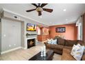 Open concept living room with fireplace and views into the kitchen and dining area at 19777 N 76Th St # 1106, Scottsdale, AZ 85255