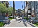 Picturesque walkway leading to the main building entrance with well-manicured landscaping at 2025 E Campbell Ave # 248, Phoenix, AZ 85016