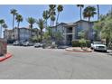 Attractive exterior with mature palm trees, meticulous landscaping, and plenty of resident parking spaces at 2025 E Campbell Ave # 248, Phoenix, AZ 85016
