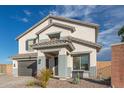 Inviting two-story home with neutral colors, desert landscaping, and a convenient two-car garage at 38659 N Alamo Ct, San Tan Valley, AZ 85140