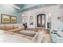 Inviting living room featuring stylish decor, hardwood floors, and elegant archways leading to other rooms at 4055 N Recker Rd # 62, Mesa, AZ 85215