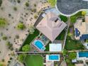 Beautiful backyard with a pool, sport court, patio, landscaping and verdant green grass at 4417 W El Cortez Trl, Phoenix, AZ 85083