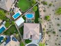 Overhead view of a landscaped estate home featuring a pool, patio, sport court, and drought-resistant landscape at 4417 W El Cortez Trl, Phoenix, AZ 85083