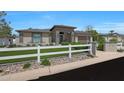 Charming home featuring a well-manicured lawn, desert landscaping, and a modern exterior elevation at 4714 E Lewis Ave, Phoenix, AZ 85008