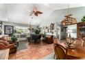 Open living space showcases a cozy seating area, dining table, and piano at 6101 E Thunderbird Rd, Scottsdale, AZ 85254