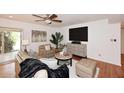 Cozy living room with a media center, stylish decor, comfortable seating, and easy access to the outdoors at 7521 S College Ave, Tempe, AZ 85283