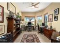 Bright office space with two workstations, built in cabinets and neutral paint at 9543 E Kiisa Dr, Scottsdale, AZ 85262
