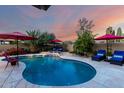 Inviting pool with lounge chairs and umbrellas, perfect for relaxation and outdoor enjoyment at 13533 N 91St Way, Scottsdale, AZ 85260