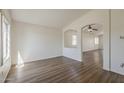 Bright living room featuring an open layout and wood-look flooring at 15962 W Gibson Ln, Goodyear, AZ 85338