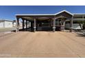Inviting home featuring a covered carport and charming front porch area at 17200 W Bell Rd # 1202, Surprise, AZ 85374