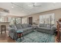 Inviting living room with plush seating, a patterned rug, and abundant natural light at 1808 E Hayward Ave # 1, Phoenix, AZ 85020
