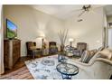 Comfortable living room featuring stylish furniture, wood floors, and a ceiling fan at 19115 E Buckskin Ct, Rio Verde, AZ 85263