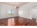 Spacious bedroom with gleaming hardwood floors and large window with pleasant views at 20801 N 90Th Pl # 210, Scottsdale, AZ 85255
