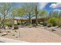 Stunning desert home with beautiful brick driveway and lush landscaping at 22469 N 79Th Pl, Scottsdale, AZ 85255