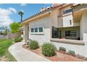 Charming single-story home featuring a beautifully landscaped yard and a cozy front patio at 2801 N Litchfield Rd # 37, Goodyear, AZ 85395