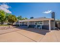 Inviting single-story home with a driveway, desert landscaping, and a cozy front porch at 3109 N 81St St, Scottsdale, AZ 85251
