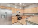 Functional kitchen with stainless steel appliances, ample counter space, and neutral cabinets at 3706 E Yeager Dr, Gilbert, AZ 85295