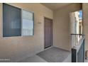 Condo entrance featuring unit number, neutral paint, and sheltered entryway at 537 S Delaware Dr # 224, Apache Junction, AZ 85120