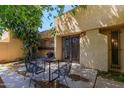 Cozy outdoor patio area, perfect for relaxation, featuring ample space and a wrought iron patio set at 6207 N 21St Dr, Phoenix, AZ 85015