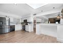 Modern kitchen with stainless steel appliances, sleek countertops, and ample cabinet space at 654 W Plata Ave, Mesa, AZ 85210