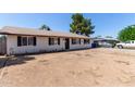 Inviting single-story home showcasing a drought tolerant yard and classic design at 8111 E Jerome Ave, Mesa, AZ 85209