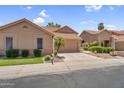 Beautiful single Gathering home with tile roof, desert landscaping, and attached two car garage at 9223 E Camino Del Santo --, Scottsdale, AZ 85260