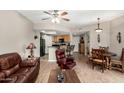 Open floor plan seamlessly connects living, dining, and kitchen areas at 10030 W Indian School Rd # 165, Phoenix, AZ 85037