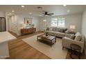 Inviting living room featuring stylish furniture, neutral color palette, and wood-look floors, creating a cozy atmosphere at 1308 N 71St St, Scottsdale, AZ 85257