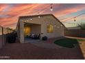 Inviting backyard features a covered patio area, perfect for outdoor entertaining and relaxation at 2292 S 236Th Dr, Buckeye, AZ 85326