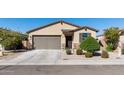 Well-maintained single-Gathering home featuring an attached garage and neatly landscaped front yard at 2292 S 236Th Dr, Buckeye, AZ 85326