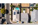 Aerial view of a home with a refreshing pool, solar panels, and a well-maintained yard at 3319 W Carter Rd, Phoenix, AZ 85041
