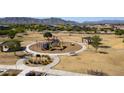 Aerial shot of a neighborhood park featuring a playground, covered picnic area, and walking paths at 3319 W Carter Rd, Phoenix, AZ 85041