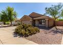 Charming single-story home featuring desert landscaping, a two-car garage and neutral color palette at 3532 S 160Th Ln, Goodyear, AZ 85338