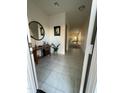 Welcoming foyer with tile flooring leads to the open concept living spaces beyond at 3602 N 300Th Dr, Buckeye, AZ 85396