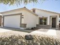 Well-maintained single-story home boasts desert landscaping, a two-car garage and decorative stone accents at 365 E Mountain View Rd, San Tan Valley, AZ 85143