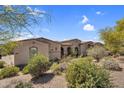 Exterior of home featuring desert landscaping and a private courtyard at 37308 N 100Th Pl, Scottsdale, AZ 85262