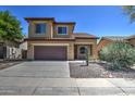 Lovely two-story home featuring a two-car garage, desert landscaping, and a cozy front entrance at 40741 N Citrus Canyon Trl, Anthem, AZ 85086