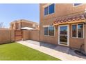 Home exterior featuring a private gated patio, artificial turf, and convenient front door parking at 4218 S 46Th Pl, Phoenix, AZ 85040