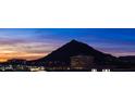 Stunning mountain views visible during sunset from this property, surrounded by local buildings at 7175 E Camelback Rd # 902, Scottsdale, AZ 85251